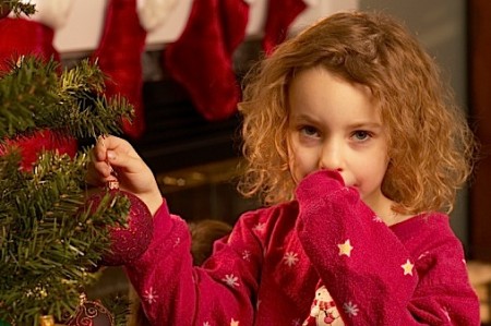 Girl decorating tree Girl decorating tree